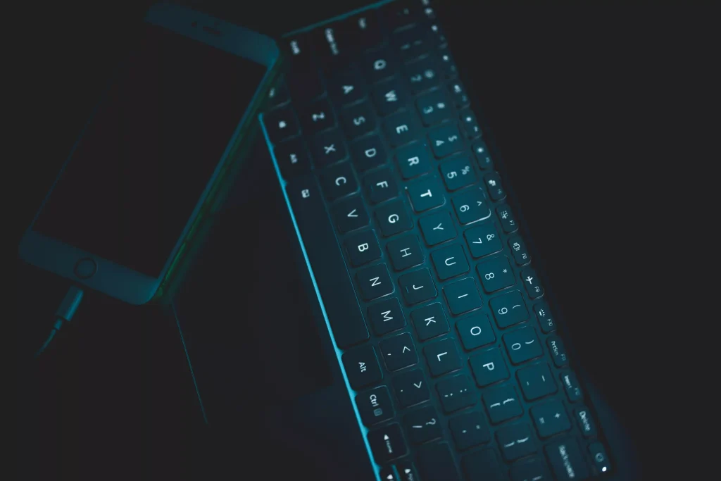 Glowing backlit computer keyboard symbolizing technical code structure and machine readability for AI search engines.